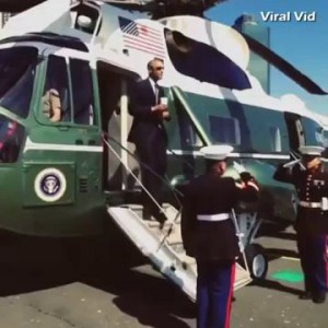 President Obama says hello to two Marines with the Latte Salute