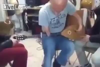 Disabled guy plays instrument.