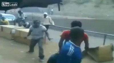Man gets beaten and thrown of a bridge onto moving traffic