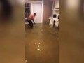 Man tries to catch fish with bare hands in flooded Texas home