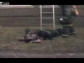 Firefighter rescuing victim takes a bad fall