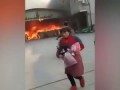 Worker rushes back to burning factory in China for phone || Worker rushes burning