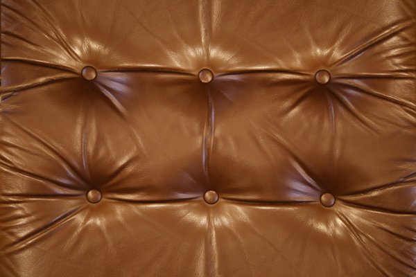 depositphotos_31191539-stock-photo-brown-leather-close-up-background-min