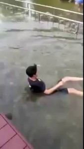 Skinny guy tries pushing a fat girl in a Satan jersey into water