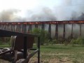 Деревянный мост горит и рушится