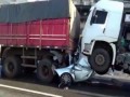 Motorist found ALIVE after being crushed between two trucks