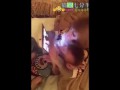 Mother monkey swipes a smartphone while her baby is watcing